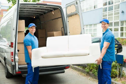 Man with a van loading furniture for a local move in Tottenham