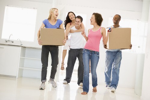 Movers loading boxes and furniture for a Tottenham home move