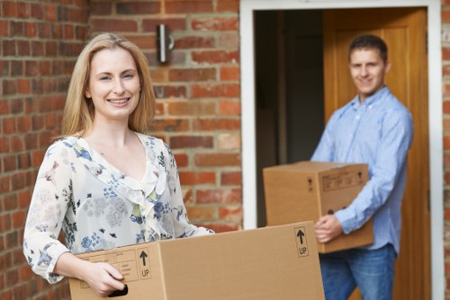 Furniture being safely carried during flat removals in Tottenham