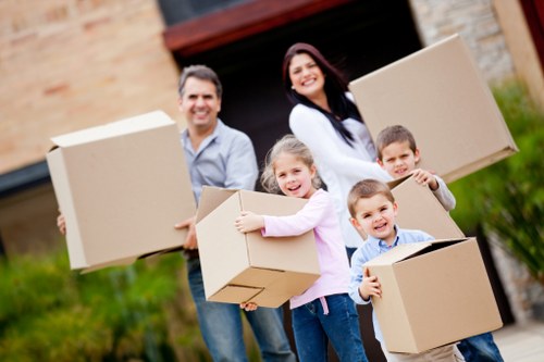 Professional van driver helping with furniture delivery in Tottenham