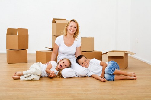 Professional movers carrying a sofa in Tottenham