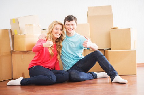 Packed boxes and furniture prepared for urgent moving service